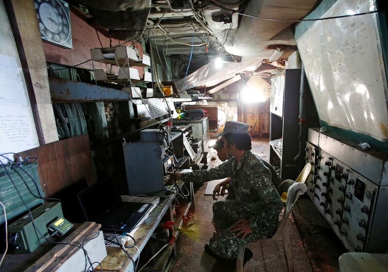 File photo shows Philippine marines in the communications room at the BRP Sierra Madre, March 29, 2014. Credit: Reuters