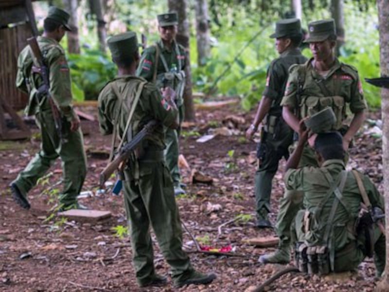 United Wa State Army soldiers take a break on a rubber plantation in the Poung Par Khem region near the border between Myanmar and Thailand, June 26, 2017.