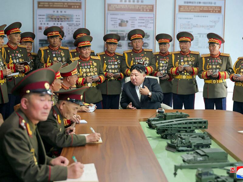 April 26, 2024 North Korea's leader Kim Jong Un (C)  visits the Kim Il Sung Military University in Pyongyang, April 26, 2024.