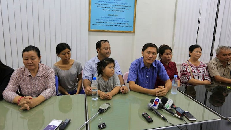 Lim Mony (first from left), Nay Vanda (third from left), Ny Sokha (fourth from right), and Yi Sokan (first from right) speak to the media in Phnom Penh after their release from pre-trial detention, June 29, 2017. Credit: RFA