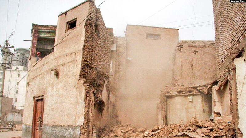 An undated photo of a building being demolished in Kasghar's Old City. (Courtesy RFE/RL)