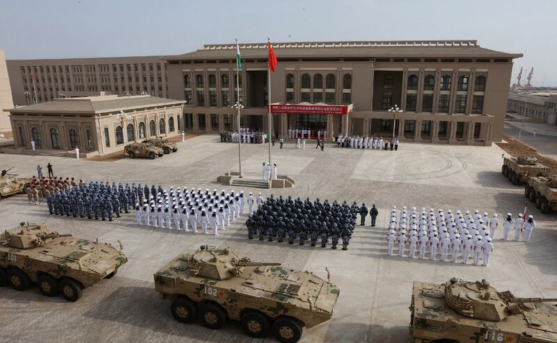 This photo taken on Aug. 1, 2017 shows Chinese People's Liberation Army personnel attending the opening ceremony of China's new military base in Djibouti. China has deployed troops to its first overseas naval base in Djibouti, a major step forward for the country's expansion of its military presence abroad. Credit: AFP