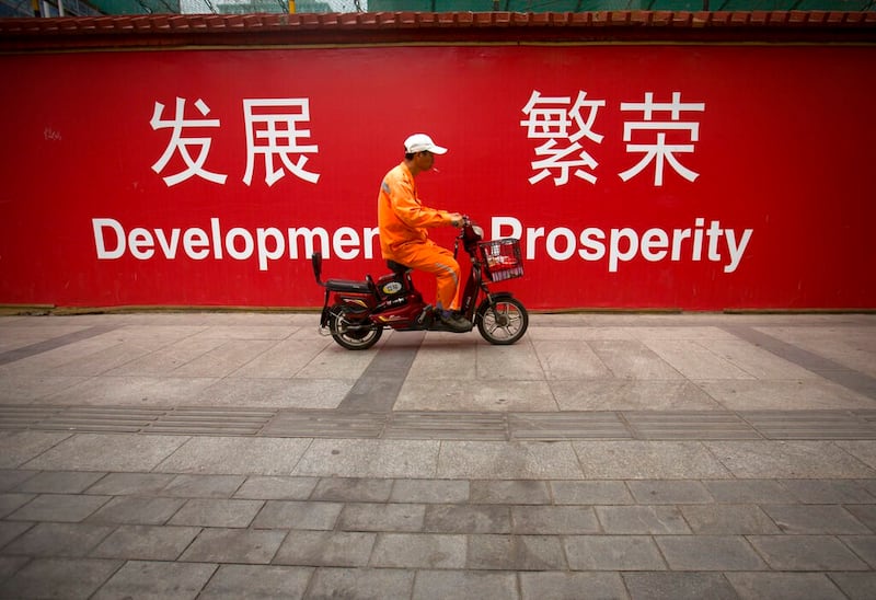 China's economy is classified as “developing” by a UN report and as “upper-middle income” by the World Bank. Credit: AP