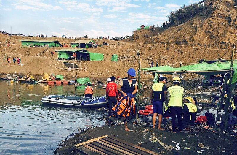 Rescue workers dredge a lake in Thayar Gone village, Dec. 22, 2021. Citizen journalist