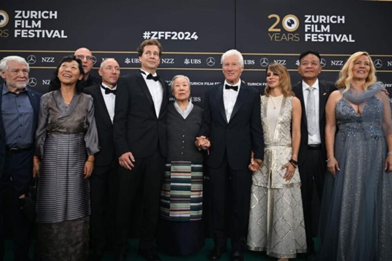 Executive producer Richard Gere (4th from R); Jetsun Pema, the younger sister of the Dalai Lama (C); Penpa Tsering, president of the Central Tibetan Administration (2nd from R); and writers and directors Philip Delaquis (5th from L) and Barbara Miller (R) attend the premiere of 'Wisdom of Happiness' at the Zurich Film Festival in Zurich, Switzerland, Oct. 8, 2024. (Nyishon via Tibet.net)