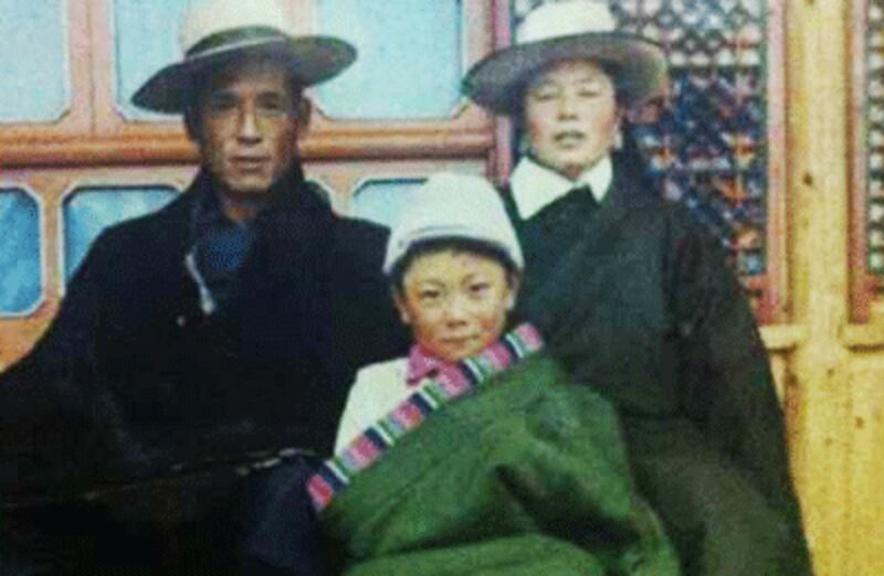 An undated photo of Dhondup (L) with his family.