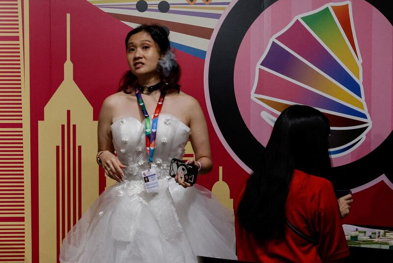 A participant wears a wedding dress during the Mahjong competition at the Gay Games in Hong Kong November 5, 2023. In mainland China, there seems to be a crackdown on the public expression of sexual minority identities. (Tyrone Siu/Reuters)