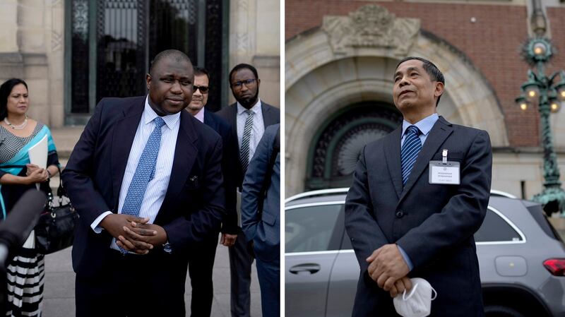 Gambia's attorney general Dawda Jallow (L) and Myanmar's agent, Union Minister Ko Ko Hlaing (R) comment outside the International Court of Justice in The Hague, Netherlands, July 22, 2022. Credit: AP Photo