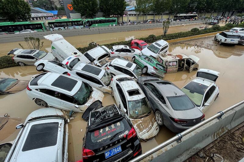 Cars sit in floodwaters after heavy rains hit the city of Zhengzhou in China's central Henan province, July 21, 2021. Credit: RFA