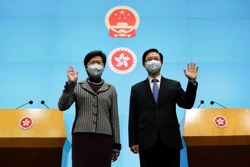 Hong Kong Chief Executive Carrie Lam attends a news conference with Chief Executive-elect John Lee. (Reuters)