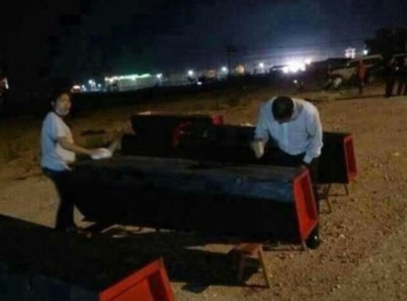 Residents prepare coffins for victims killed in a bombing in Lincang, in China's Yunnan province, March 16, 2015. Credit: EyePress News