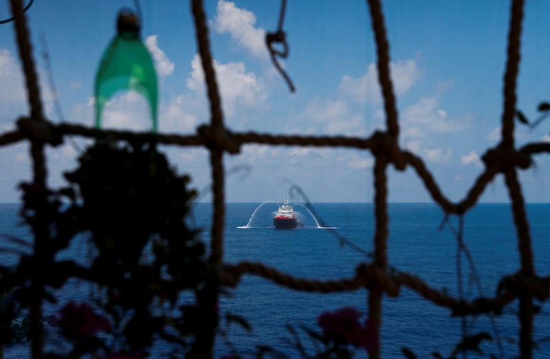 A supply vessel sprays water near the Lan Tay gas platform, operated by Rosneft Vietnam, in the South China Sea off  Vietnam on April 29, 2018.