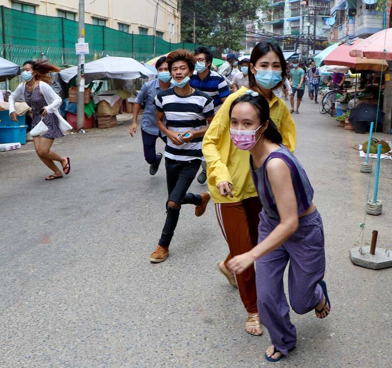 When police and soldiers arrive to disperse the demonstration, the protesters take off. (Associated Press)