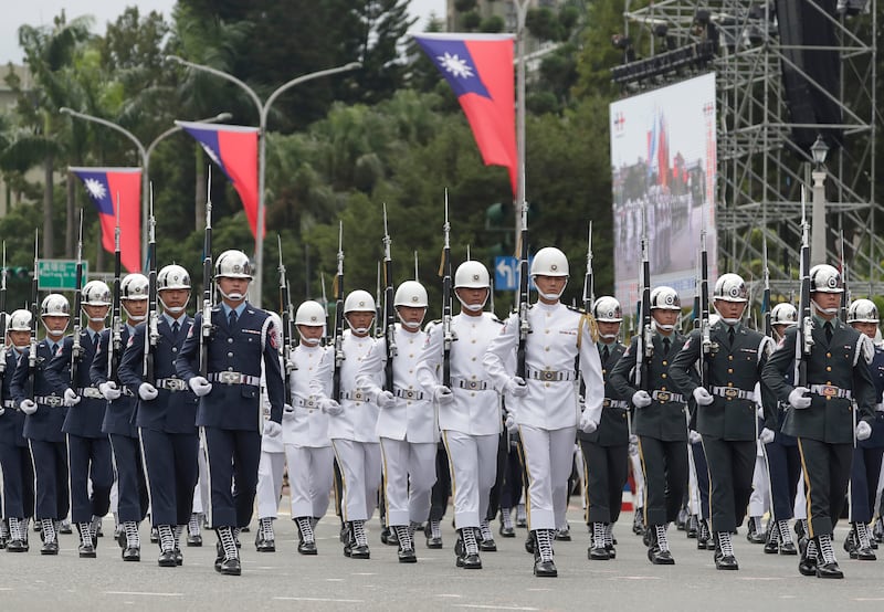 A military honor guard attends National Day celebrations in front of the Presidential Building in Taipei, Taiwan, Thursday, Oct. 10, 2024.