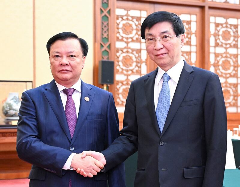 Vietnam Communist Party official Dinh Tien Dung, left, meets with Chinese Communist Party official Wang Huning in Beijing, Sept. 28, 2023. (Yan Yan/Xinhua via Getty Images)