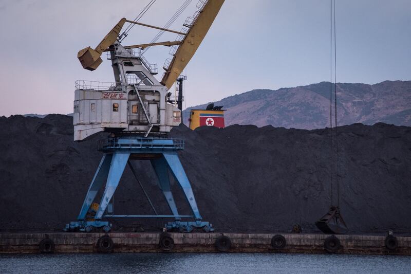 A mountain of North Korean coal -- which would once have been bound for China -- is piled up in Rajin harbour, stranded by a UN ban on coal exports by Pyongyang, Nov. 20, 2017. Credit: AFP