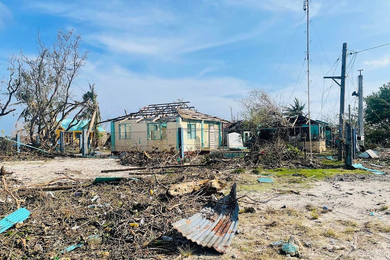 This undated handout photo received from the Philippine Coast Guard (PCG) on December 22, 2021 shows a damaged building on Thitu island in the disputed Spratly Islands, days after Super Typhoon Rai hit the southern and central regions of the archipelago. Credit: AFP