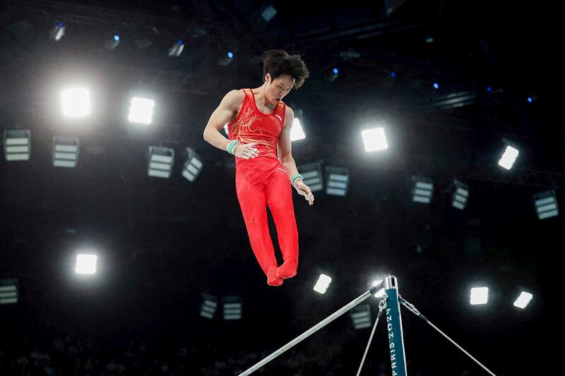 Chinese gymnast Su Weide competes on the high bar at the Paris Olympics, July 29, 2024. (Reuters)