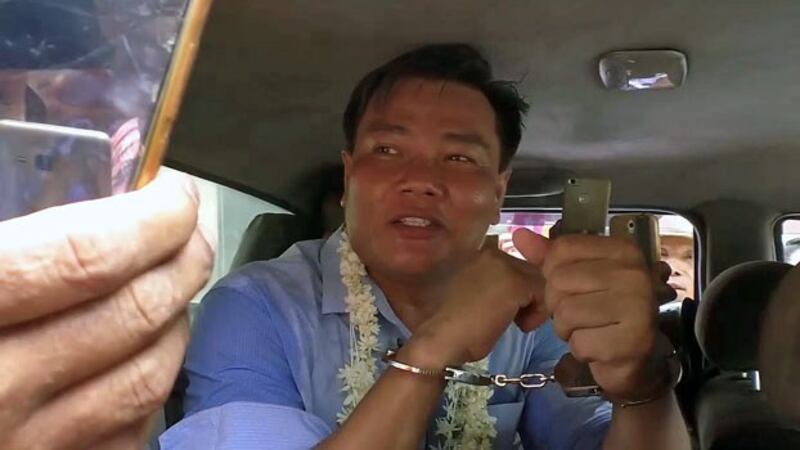 Former military captain Nay Myo Zin is driven away in a police car outside Taikkyi Township Court after a judge denies him bail, in Yangon region, April 19, 2019.