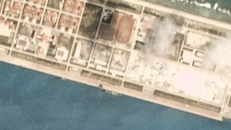 Closer view of satellite image taken March 19, 2020, over the Chinese-occupied base at Mischief Reef, showing a large vessel at the quayside. 