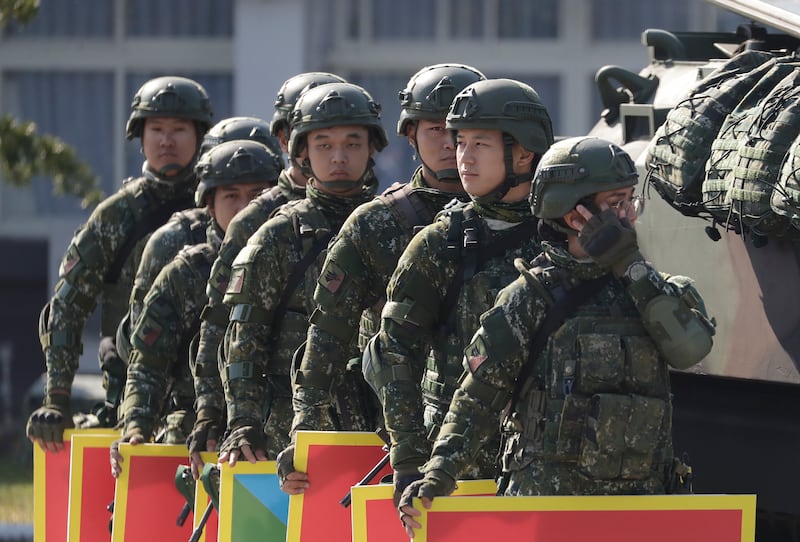 Taiwanese soldiers take part in a drill while Taiwan’s President Lai Ching-te inspects its military at a military base in Taitung County, eastern Taiwan, Tuesday, Jan. 21, 2025.