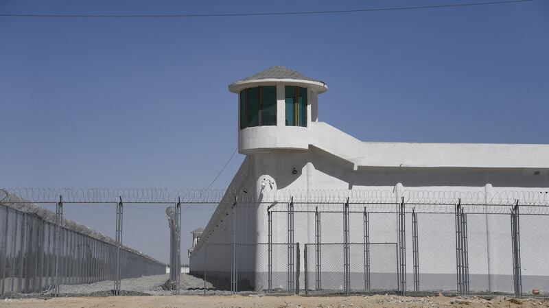 A watchtower overlooks a high-security facility on the outskirts of Hotan, in northwestern China's Xinjiang Uyghur Autonomous Region, May 31, 2019.