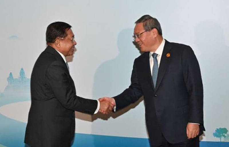 Myanmar junta chief Senior Gen. Min Aung Hlaing shakes hands with China’s Prime Minister Li Qiang at the Greater Mekong Subregion Summit in Kunming in China's Yunnan province, Nov. 6, 2024.