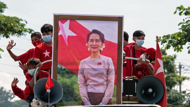 National League for Democracy party supporters take part in an election campaign event with a portrait of Myanmar State Counselor Aung San Suu Kyi, in Yangon, Oct. 25, 2020. 