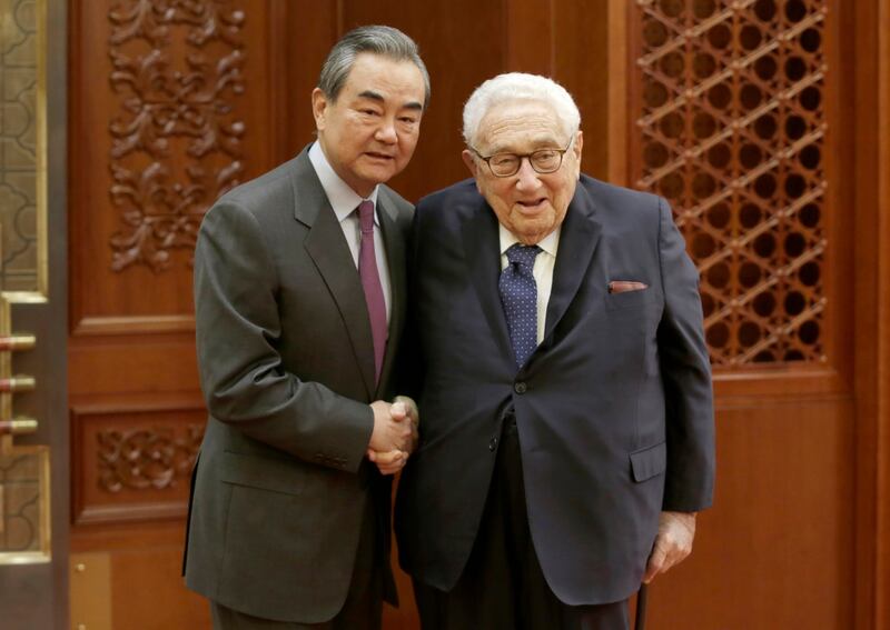 China's Foreign Minister Wang Yi meets former Secretary of State Henry Kissinger at the Great Hall of the People in Beijing, Nov. 22, 2019. (Jason Lee/Pool via AP)